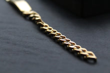 Load image into Gallery viewer, Stainless steel I.D curb bracelet with gold IP plating.
