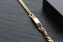 Load image into Gallery viewer, Stainless steel I.D curb bracelet with gold IP plating.

